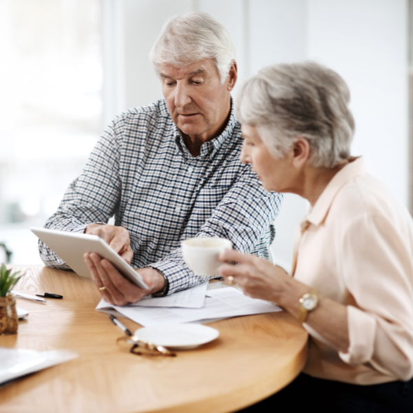 an older couple discussing a financial transaction